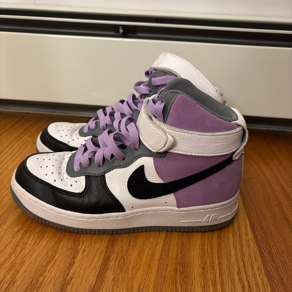 Purple, grey, and black customized Nike Jordan’s